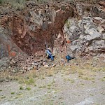 Brian Malahoff, P.Geol sampling Mexican Hat’s gold-bearing hematite mineralization, south-side of hill